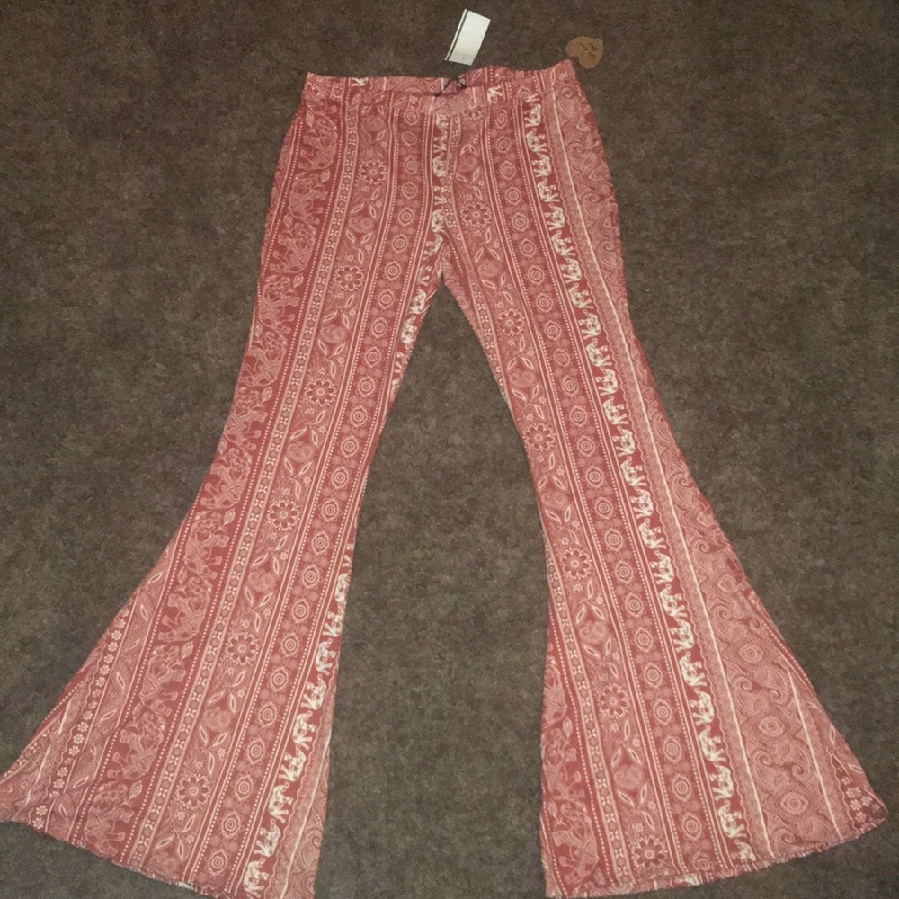 Rust orange stretch pants.